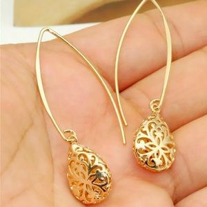 Romantic gold earrings measure 2 inches in length